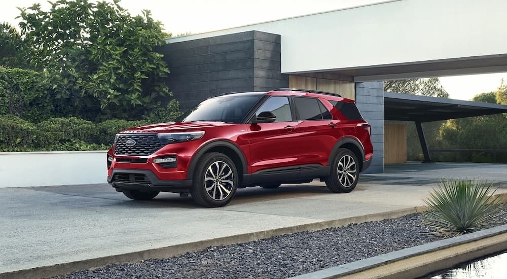A red 2023 Ford Explorer ST for sale is shown parked in a driveway