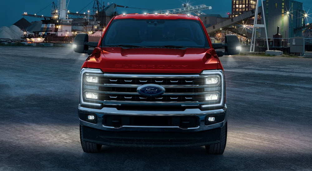 Front of a red 2026 Ford F-250 parked on a parking lot.