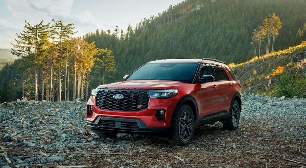 A red 2026 Ford Explorer ST parked off-road.