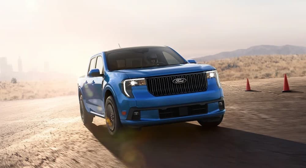 A blue 2026 Ford Maverick LOBO driving on a track.