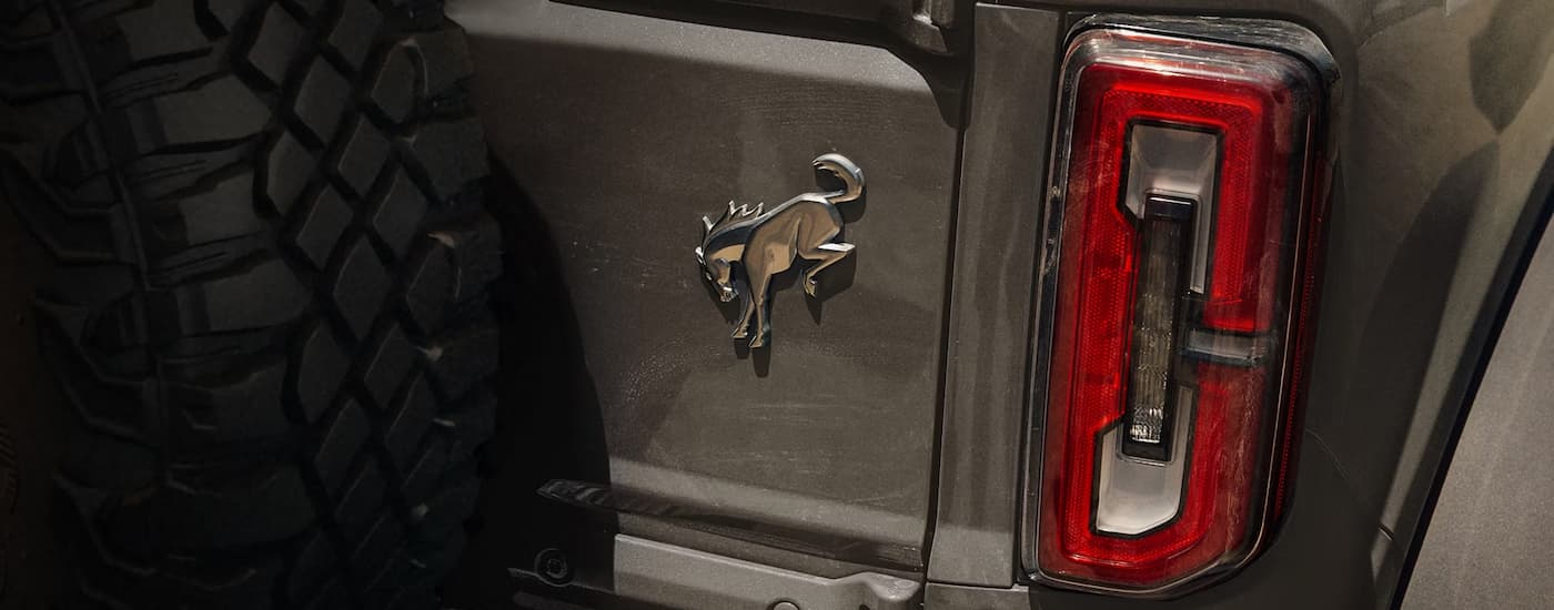 Silver badge on the back of a grey 2026 Ford Bronco