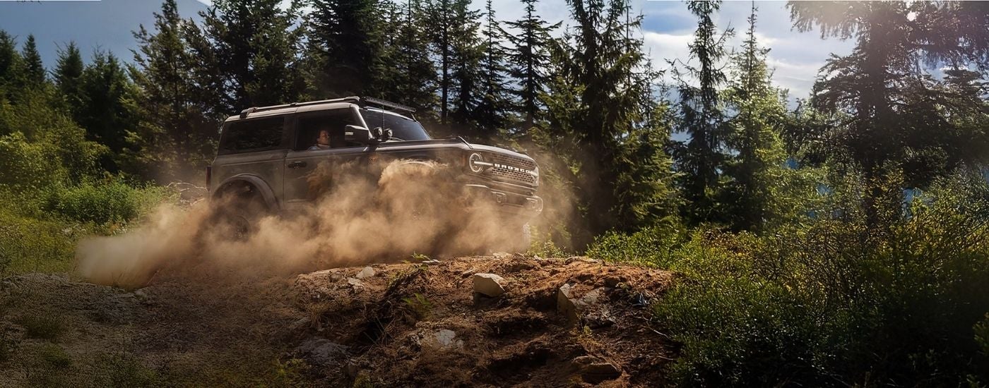 Grey 2026 Ford Bronco Badlands kicking up dust