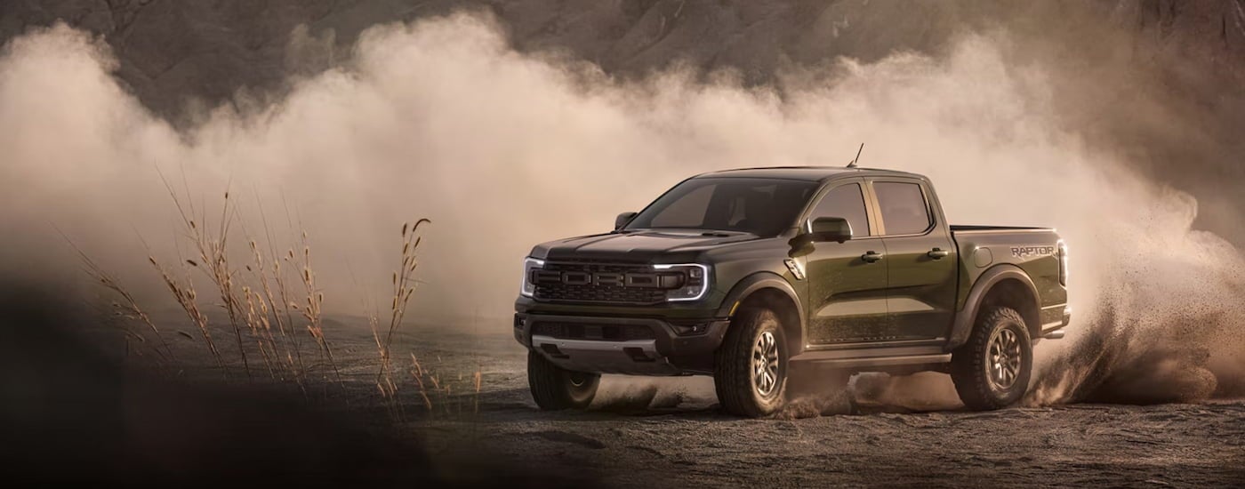 Green 2026 Ford Ranger driving around a bend.