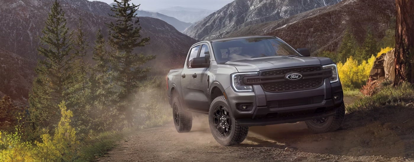 Grey 2026 Ford Ranger driving off-road.