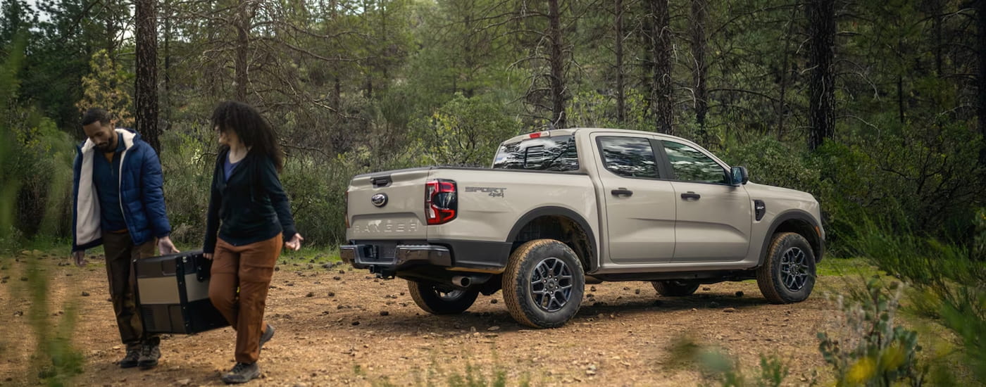 Rear of a white 2026 Ford Ranger parked off-road.
